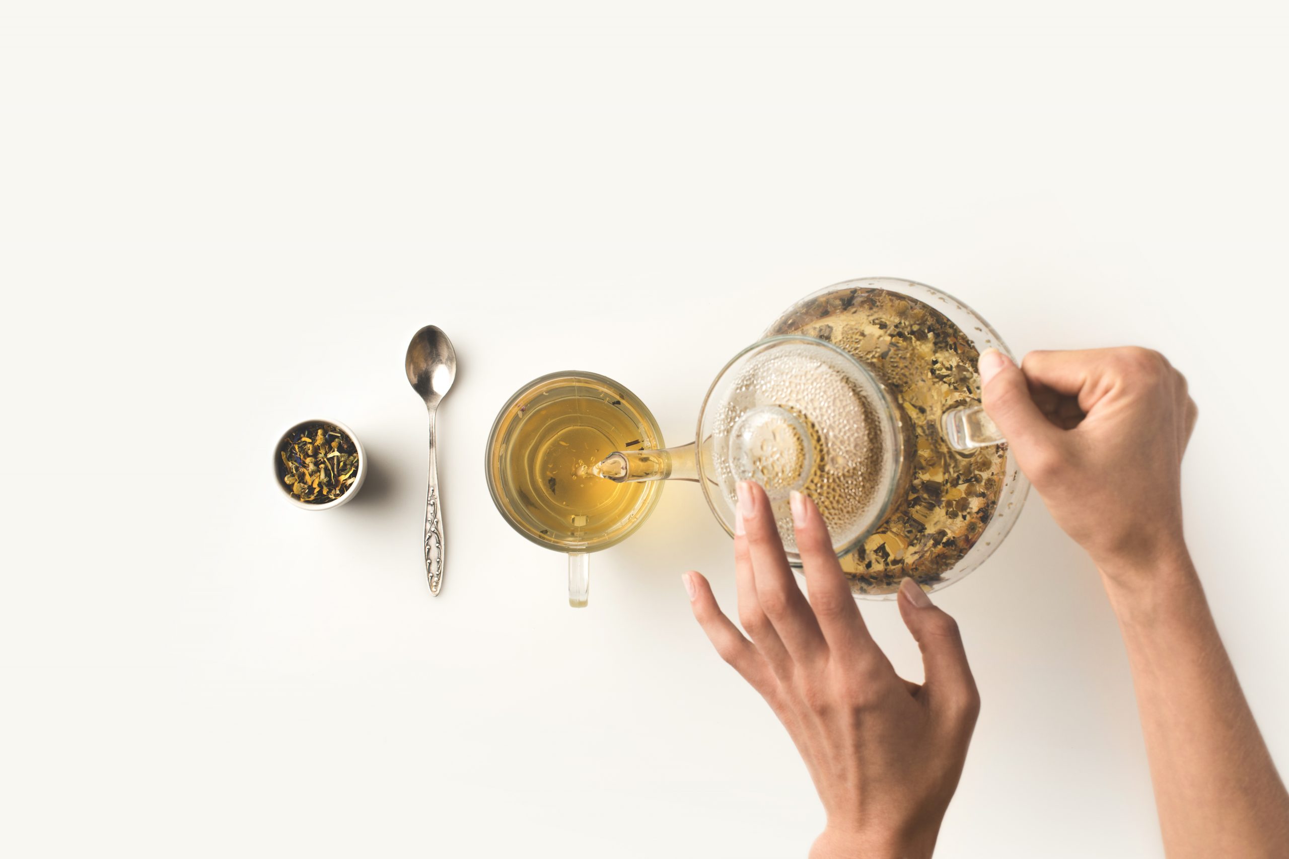 Top,View,Of,Person,Pouring,Fresh,Organic,Herbal,Tea,From