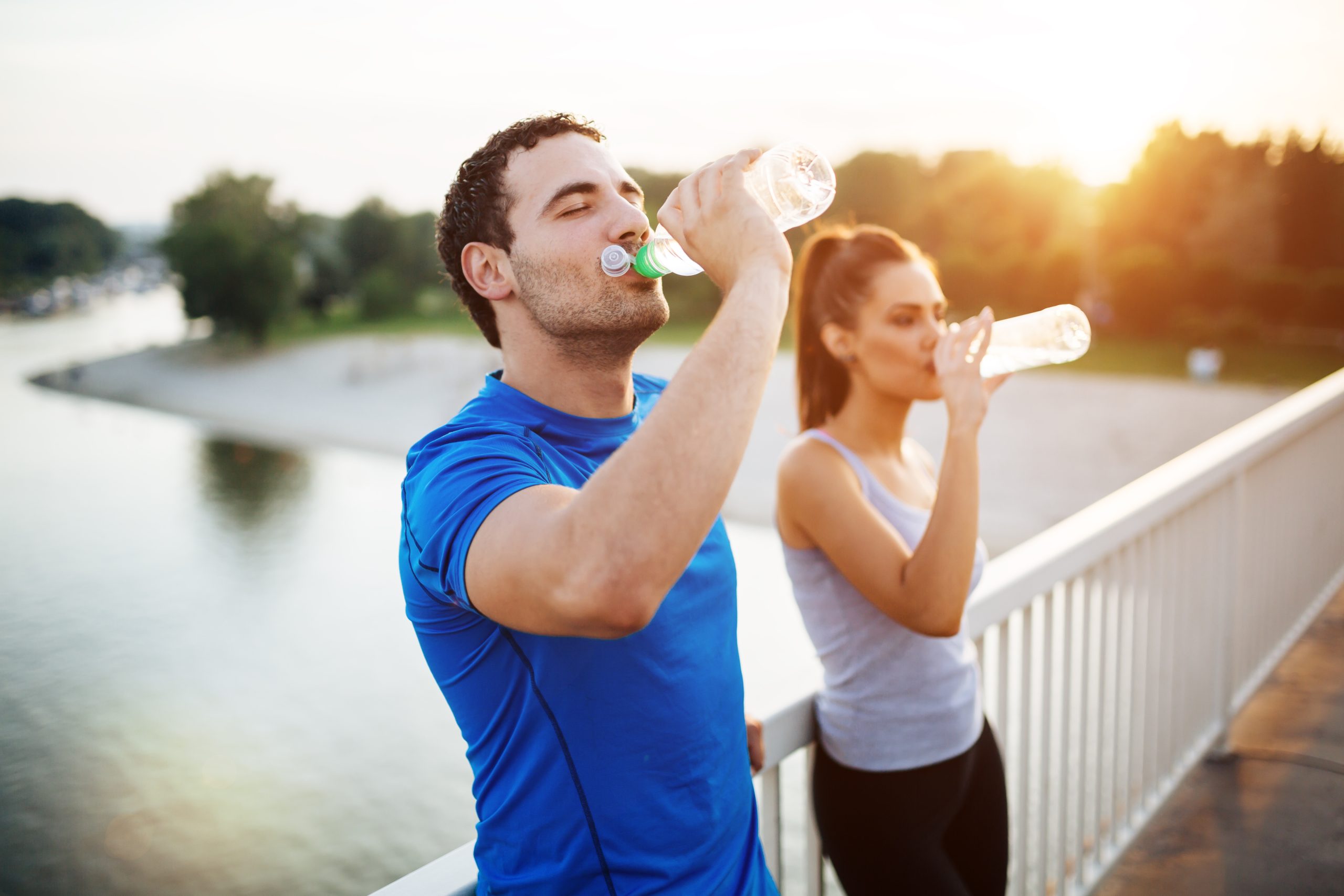 Couple,Staying,Hydrated,After,Workout